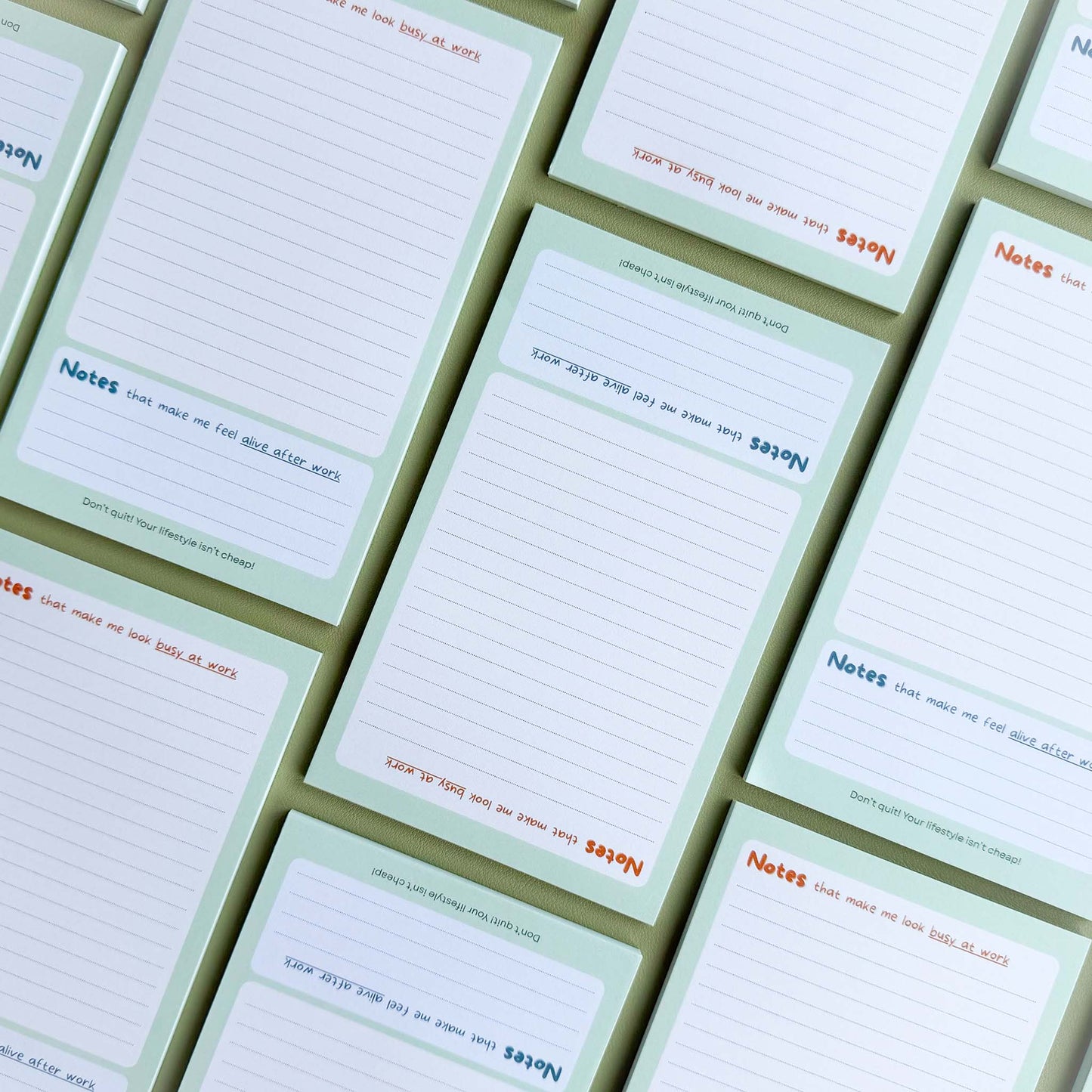 Multiple 'Busy at work, alive after work' notepads laid out in a grid pattern showing the dual 'Notes' section layout