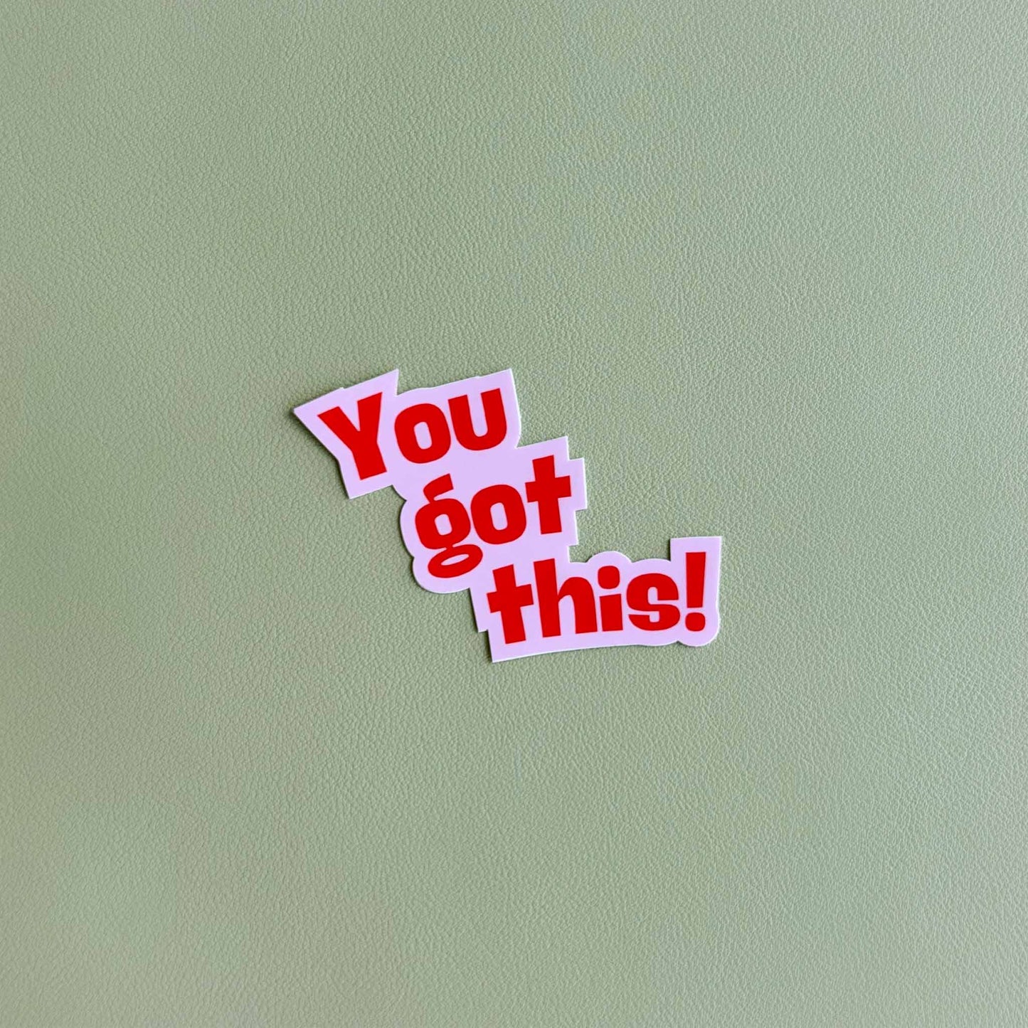 Vinyl sticker that reads 'You got this!' in bold red hand-lettered script on a pink die-cut background
