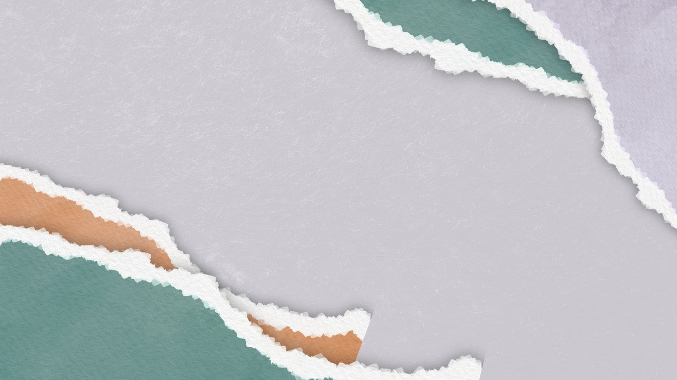 Torn pieces of paper in different colors on a gray background