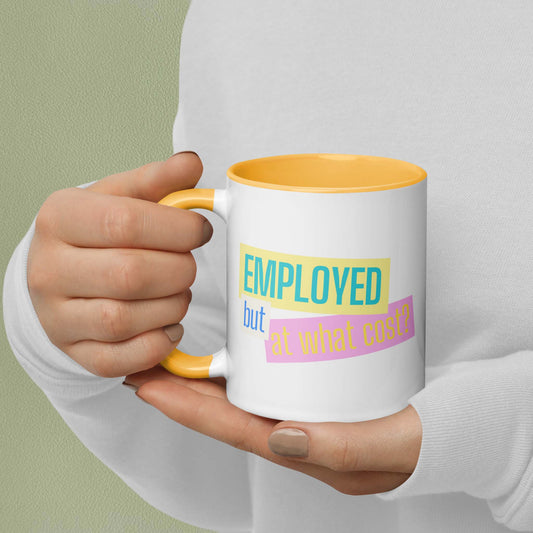 Hand holding a mug with text 'EMPLOYED but at what cost?' on a plain background
