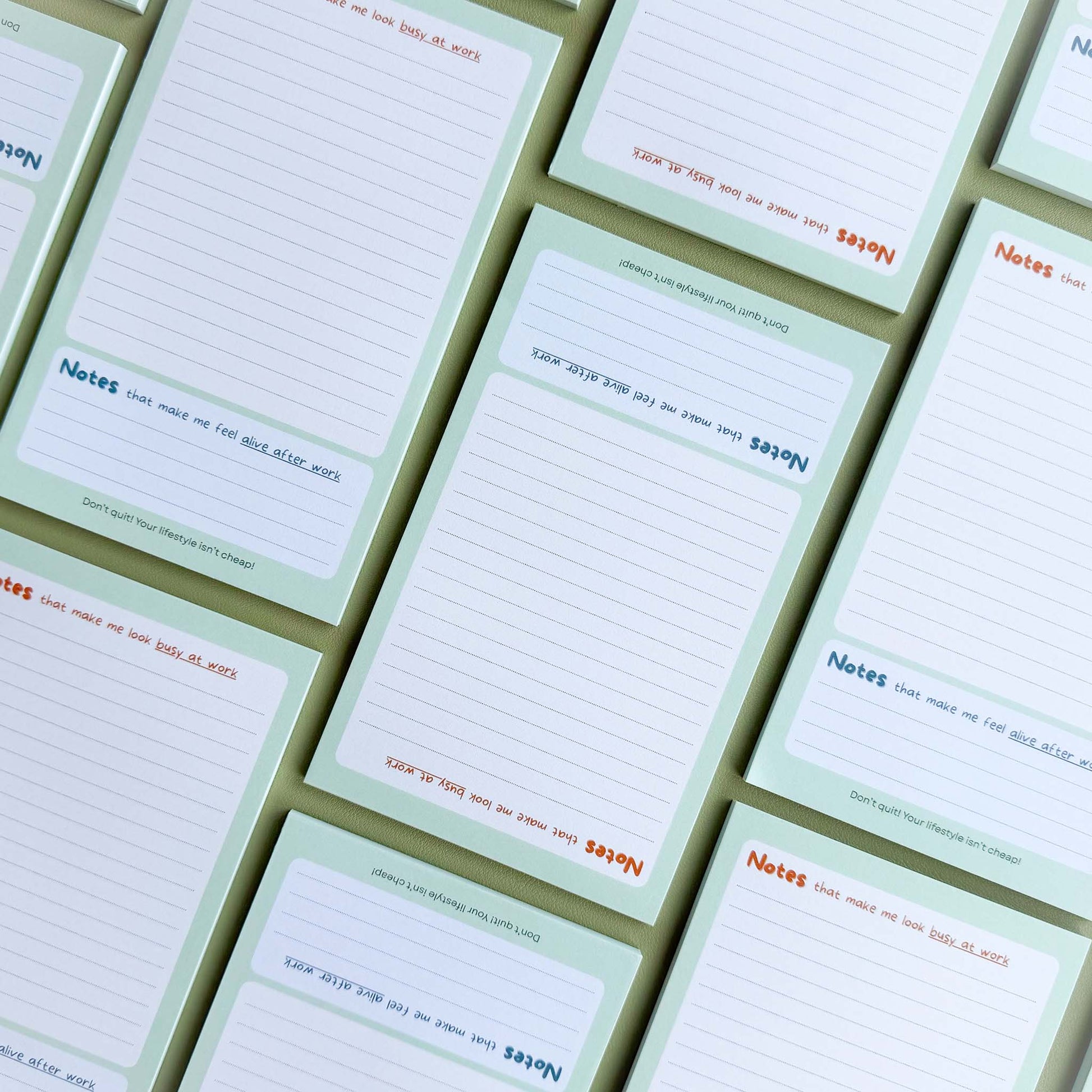 Multiple 'Busy at work, alive after work' notepads laid out in a grid pattern showing the dual 'Notes' section layout