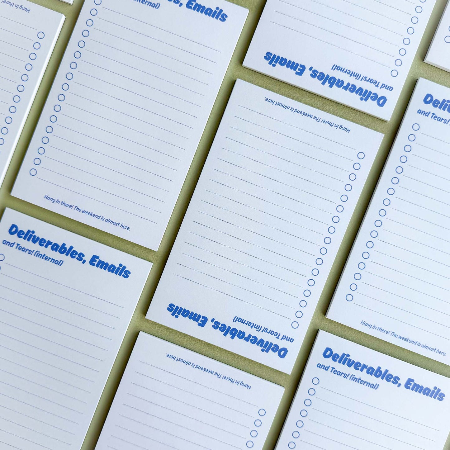 Multiple 'Deliverables, emails, and tears (internal)' to-do list notepads laid out in a grid pattern showing the checklist layout