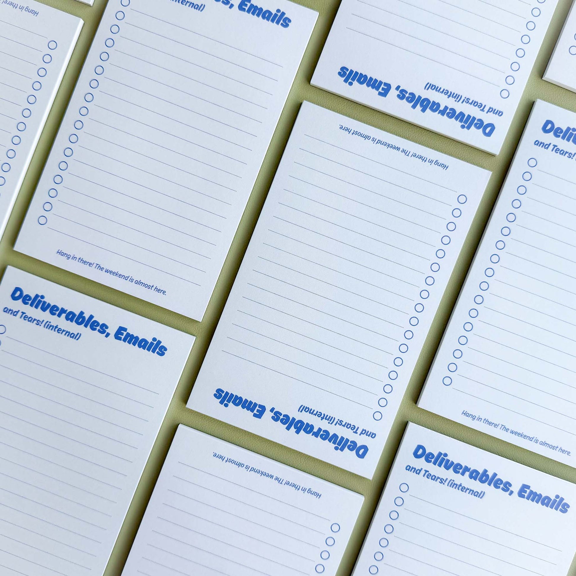 Multiple 'Deliverables, emails, and tears (internal)' to-do list notepads laid out in a grid pattern showing the checklist layout