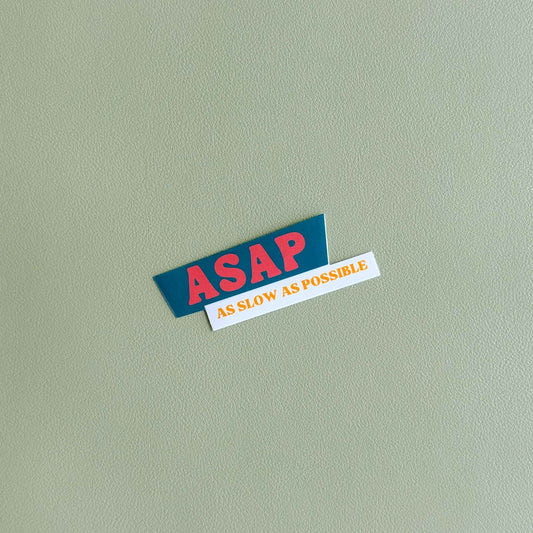 Vinyl sticker that reads 'ASAP' in bold dark orange text above 'As slow as possible' in orange text on white