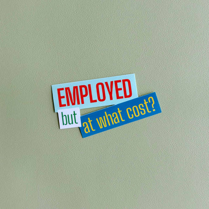 Close-up of the 'Employed but at what cost?' vinyl sticker in light blue, white, and green