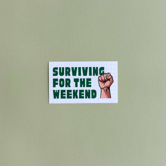 Vinyl sticker that reads 'Surviving for the Weekend' in a bold retro font with a raised fist illustration